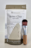 Mudology Aztec Clay facial masque package with a brush on a white background