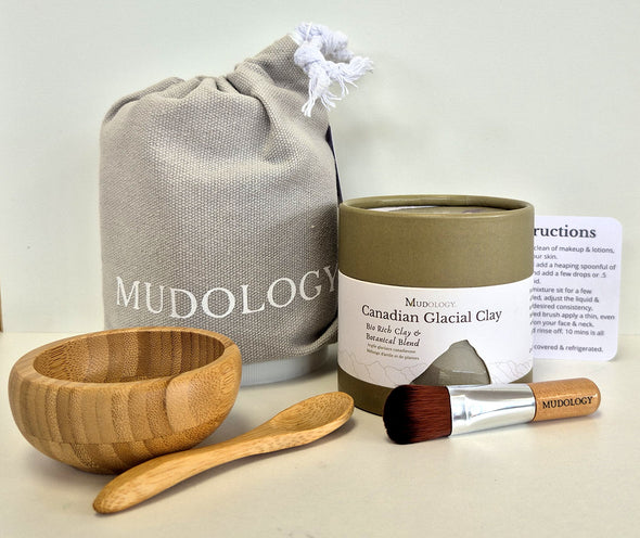 Mudology Canadian Glacial Clay facial masque spa kit with 100g tub of clay, wood bowl and spoon, applicator brush, cotton pouch and instructions