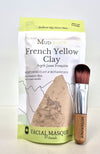 Mudology French Yellow Clay facial masque package with a brush on a white background